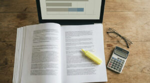 Reviewing account terms with a calculator to check the bonus credit stop-out level